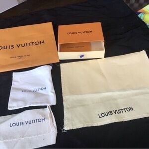 Louis Vuitton box, shopping bag and three storage bags